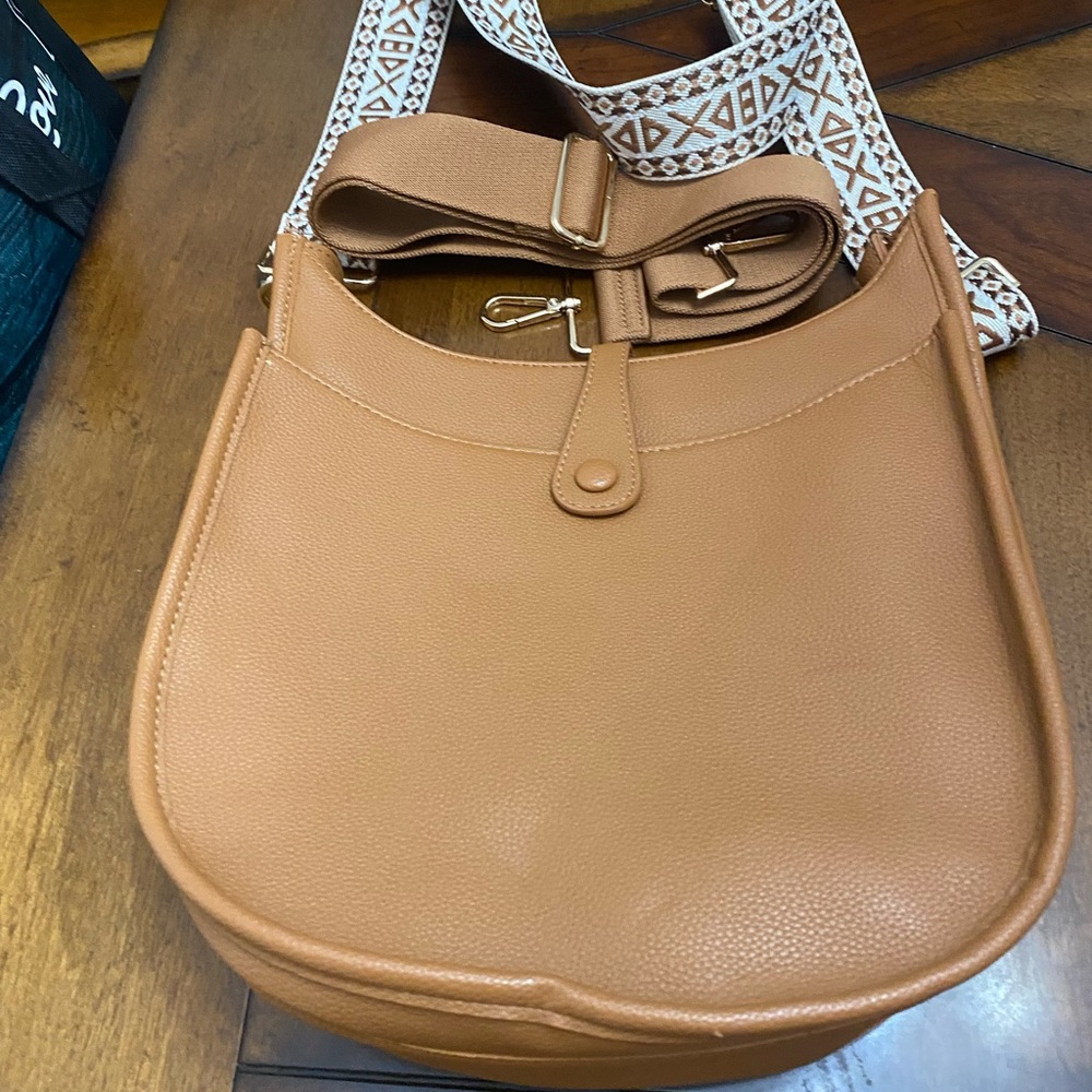 Ah.dorned pebble tan Leather Crossbody Bag with Buckle Detailing